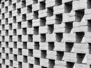 Textured white brick wall with repeating pattern